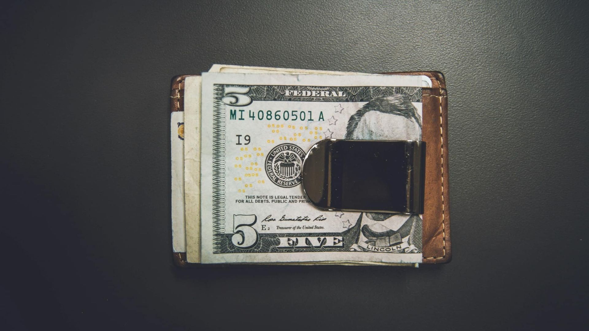 A 5usd bill in a wallet